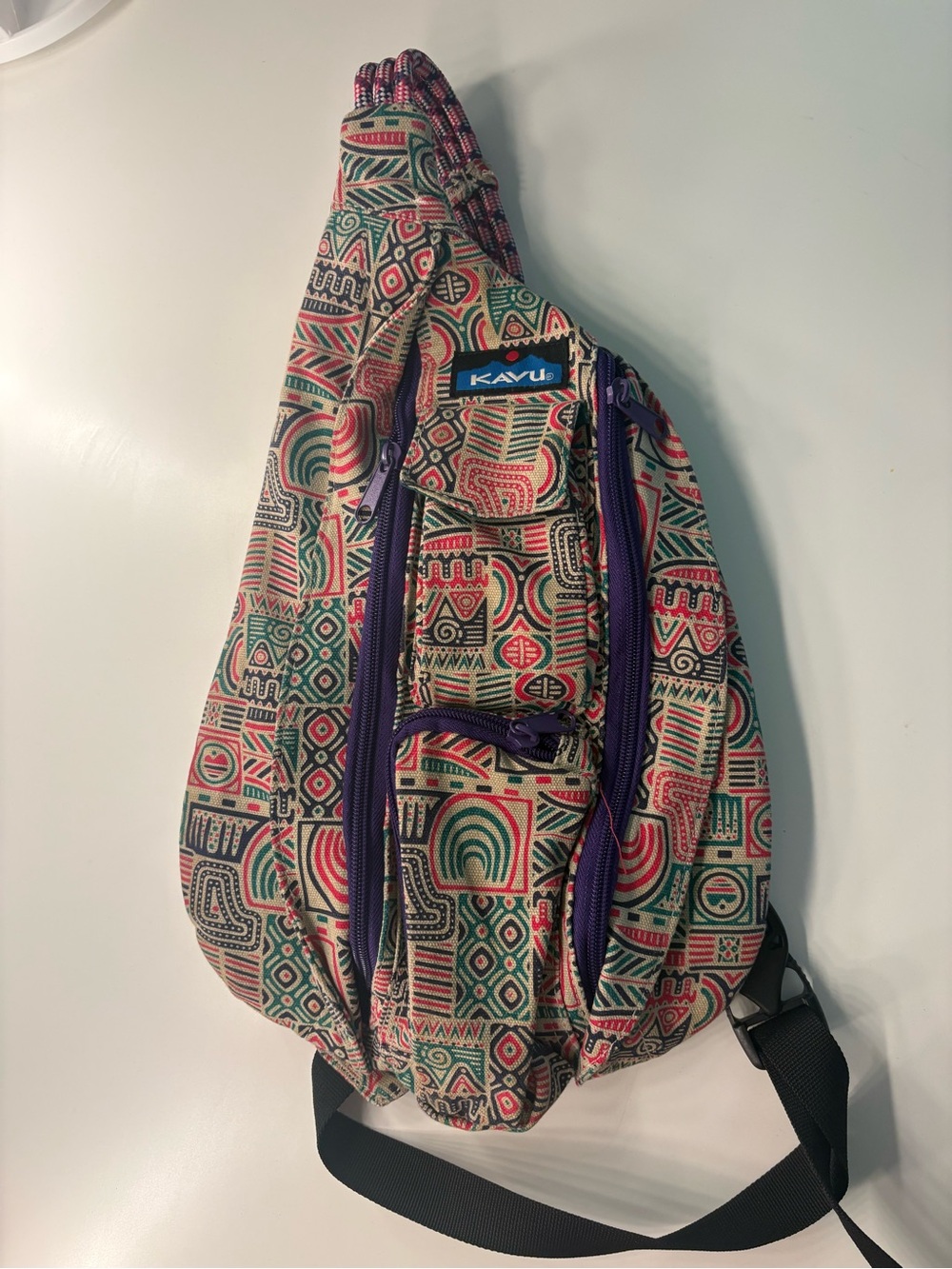 Kavu Geometric Sling Pack in Cream, Green & Red with Purple Accents